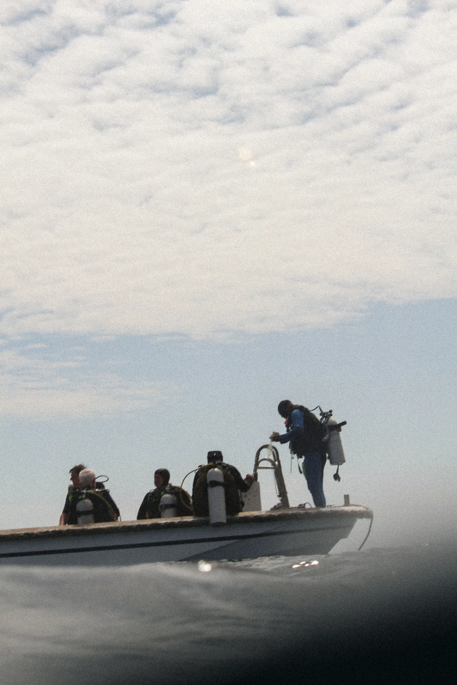 Divers getting ready on a dive tender.