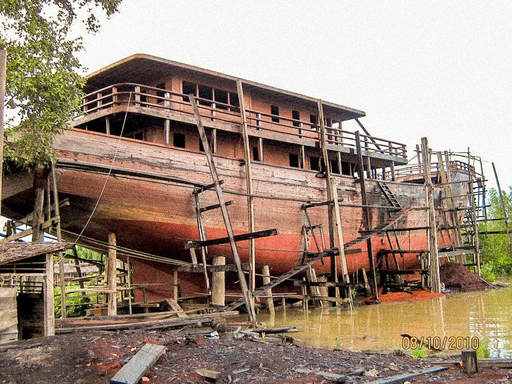 WAOW's hull under construction on the shore.