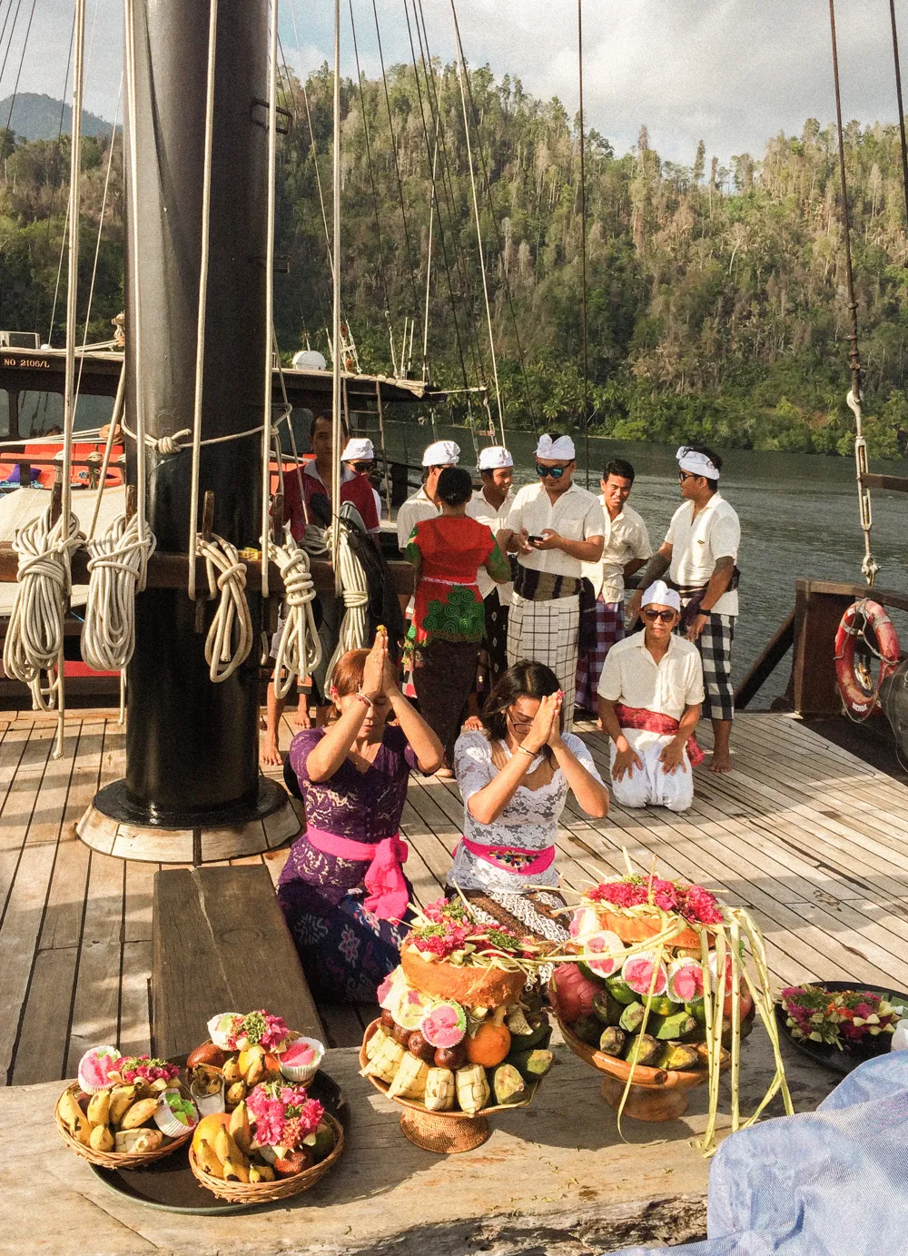 A blessing ceremony with offerings on the deck.