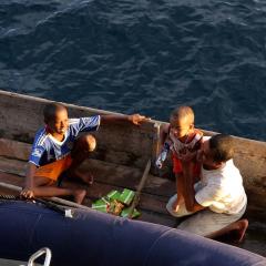 Phinisi sailing yacht for scubadiving MSY WAOW anchoring in Misool RajaAmpat Indonesia, locals in RajaAmpat Indonesia
